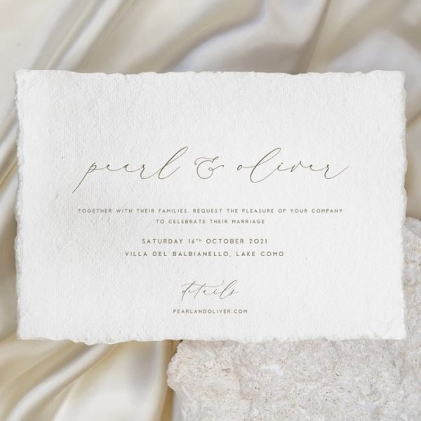 Minimalist wedding invitation with deckled edges and script font