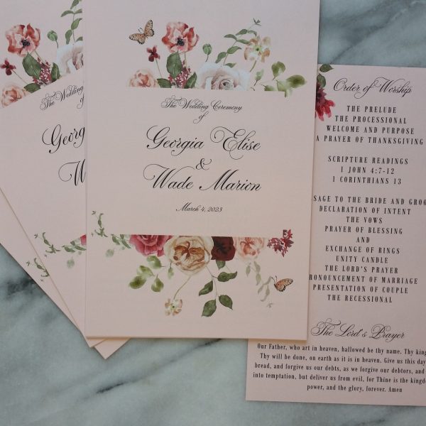 Floral wedding ceremony program with elegant calligraphy