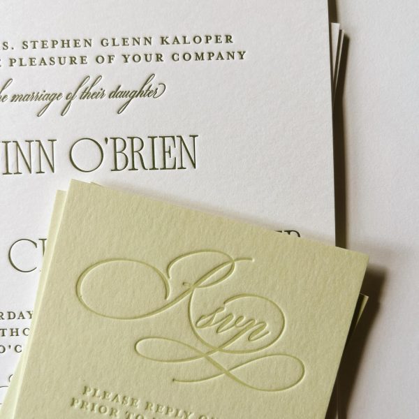 Elegant embossed wedding invitation with RSVP card in cream