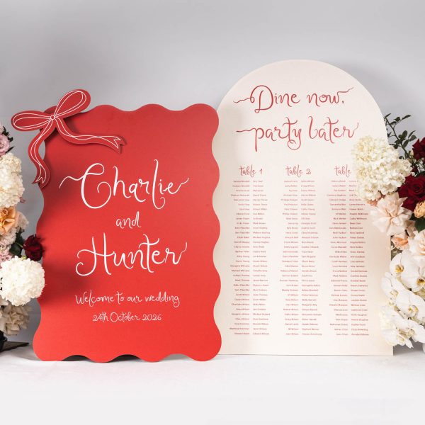 Red wedding welcome sign and seating chart with modern calligraphy