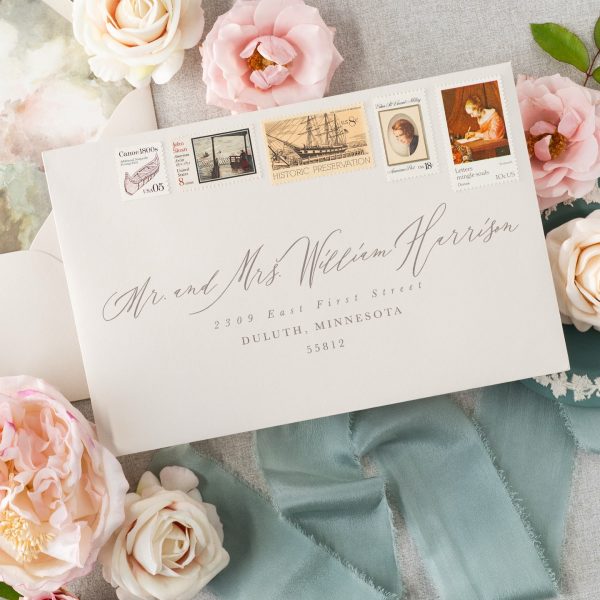 Elegant Wedding Envelope with Vintage Stamps and Script Calligraphy