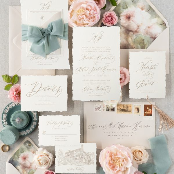 Romantic wedding invitation suite with calligraphy and floral details