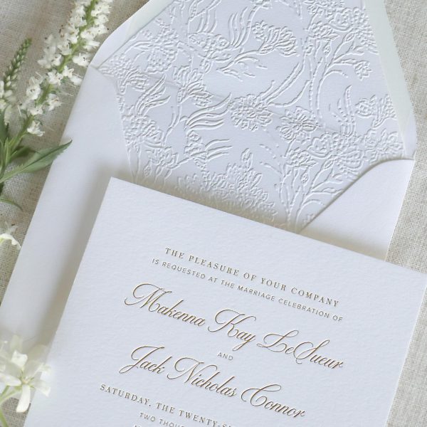 Classic embossed white wedding invitation with elegant script