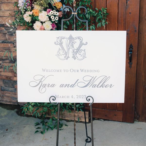 Wedding Sign with Flowers at Venue Entrance